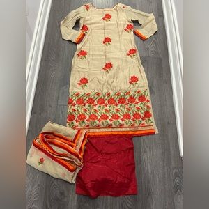 Beige and red kurta with embroidery. Red palazzo pants